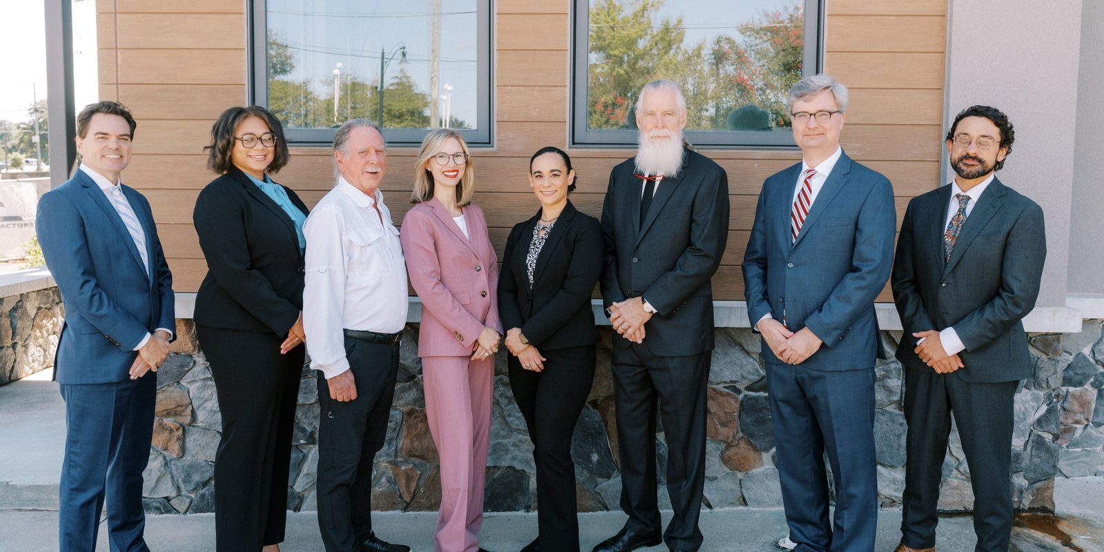 The eight attorneys of Lowrey, Fortner, & Miri P.A. Left to right: Shawn M. Lowrey, Jourdan L. Green, Erik M. Lowrey, Kimberly-Joy (KJ) Miri, Valorie G. Cochran, Thomas (Tom) Fortner, Richard Filce, and Arman Miri.